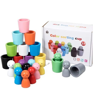 Color sorting cup toy set with cups and peg people in front of its packaging.