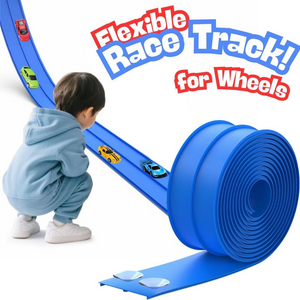 Child playing with a blue flexible race track for toy cars on a white background
