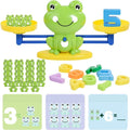 Educational toy set with a frog design, numbers, and shapes on a balance scale.