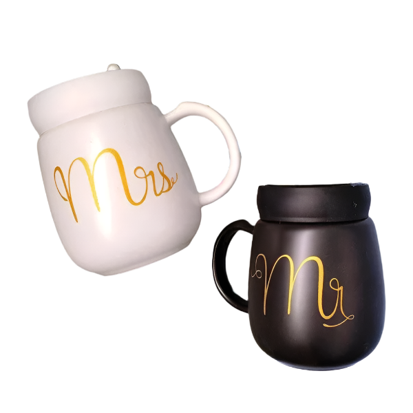 Close-up of yin-yang inspired ceramic mugs with ergonomic handles.