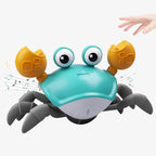 Toy crab with music notes and a hand interacting with it on a white background