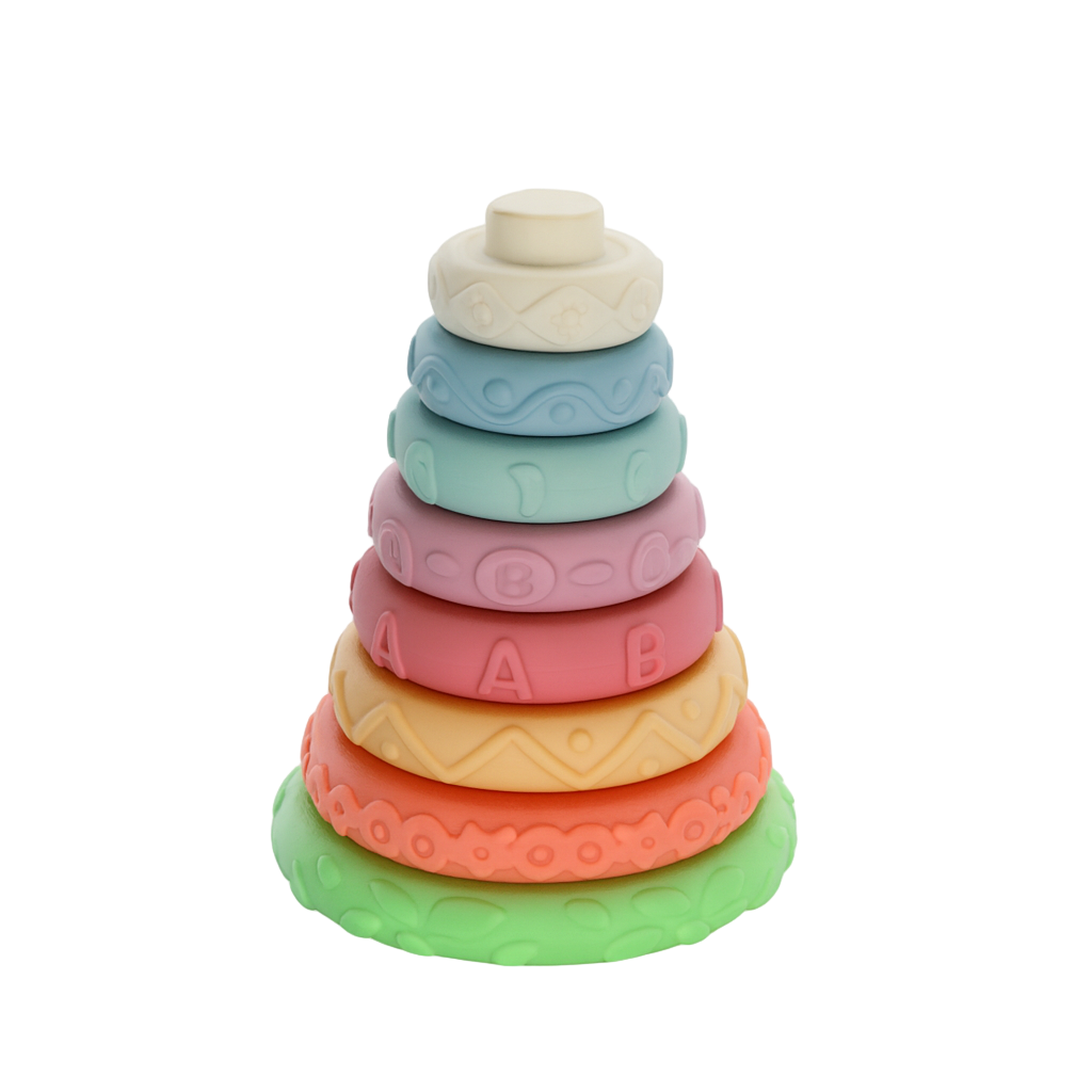 Stack of colorful baby rings with text on a white background