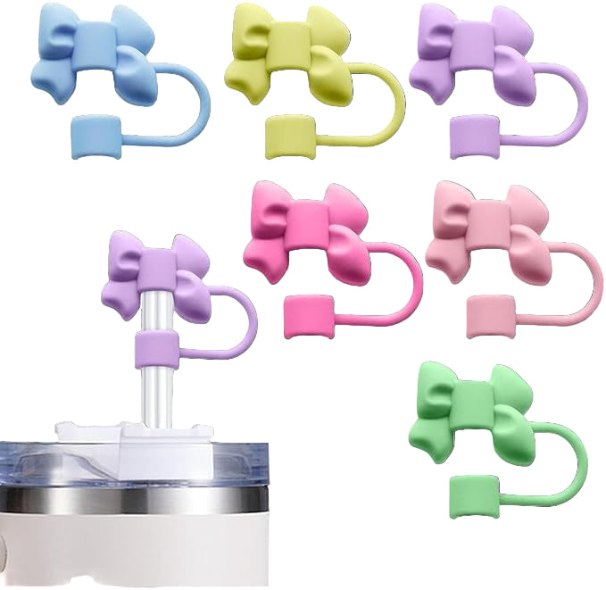 Colorful bow-shaped hair ties on a black background