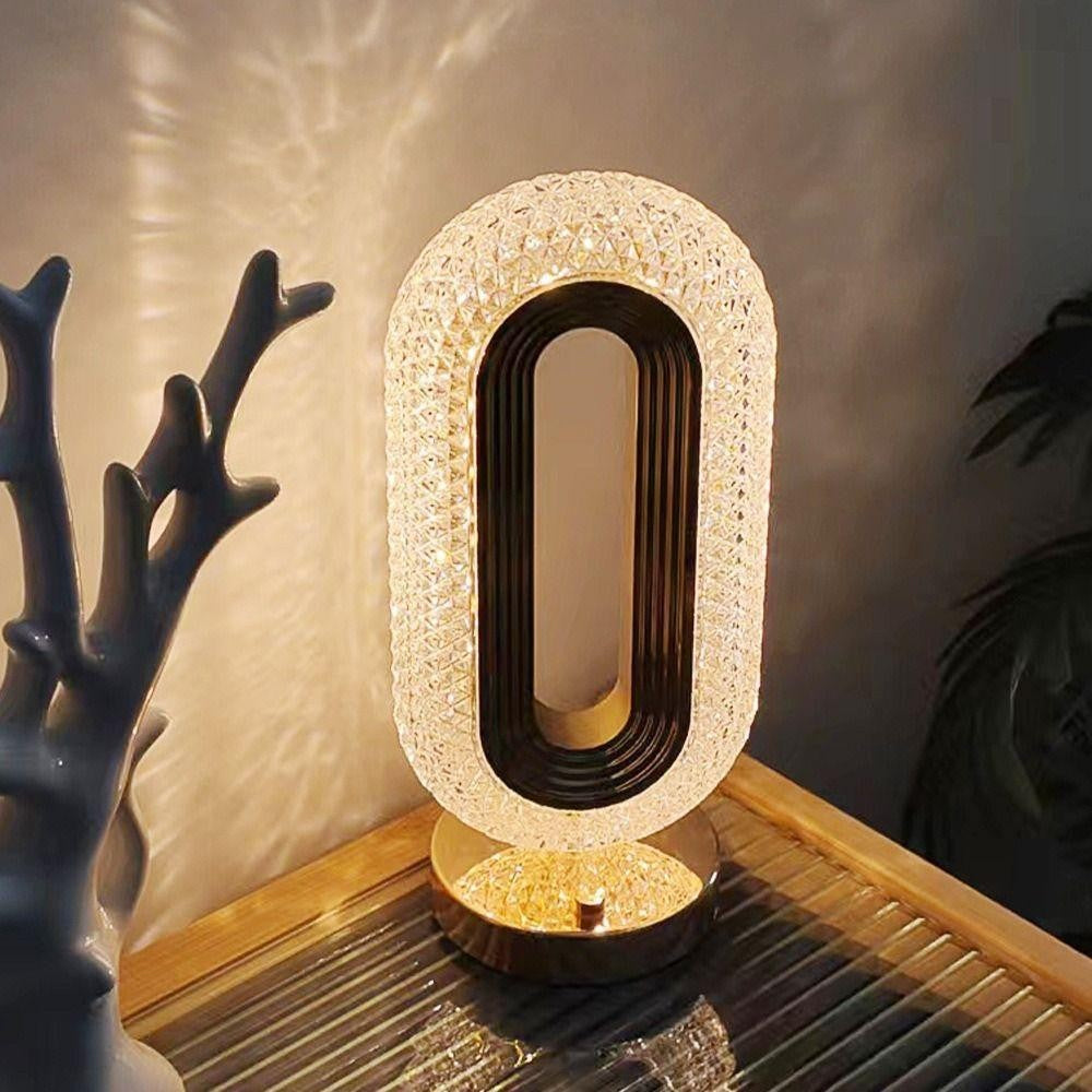 Elegant Crystal Table Lamp with transparent acrylic lampshade and golden iron body, showcasing its stepless dimming feature and multiple light color options.