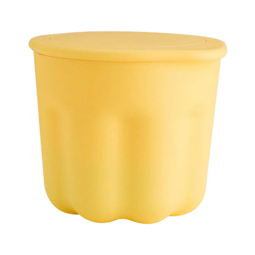 Yellow plastic container with a lid on a white background