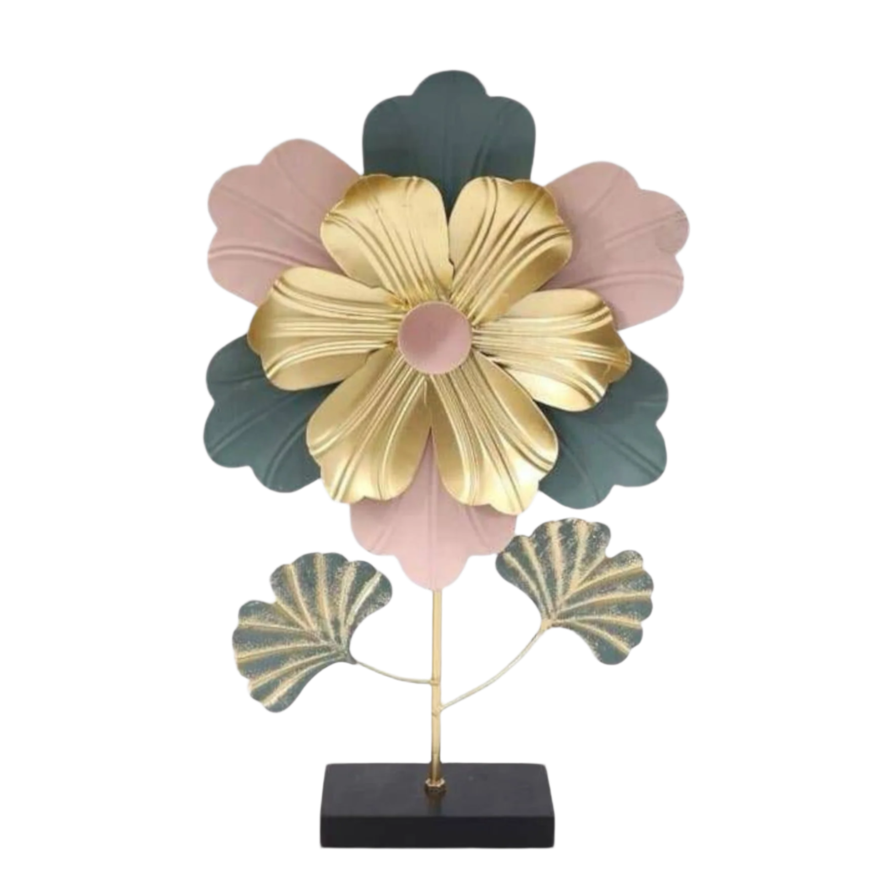 Gold and green metal monstera leaf decor on a modern living room shelf.