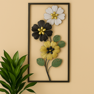 Rectangular black frame showcasing elegantly arranged metal flowers in black, white, and gold hues, accented with stylish green leaves.








