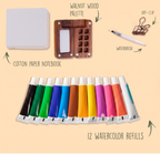 Set of watercolor refills with a palette, notebook, waterbrush, and art clip on a beige background.