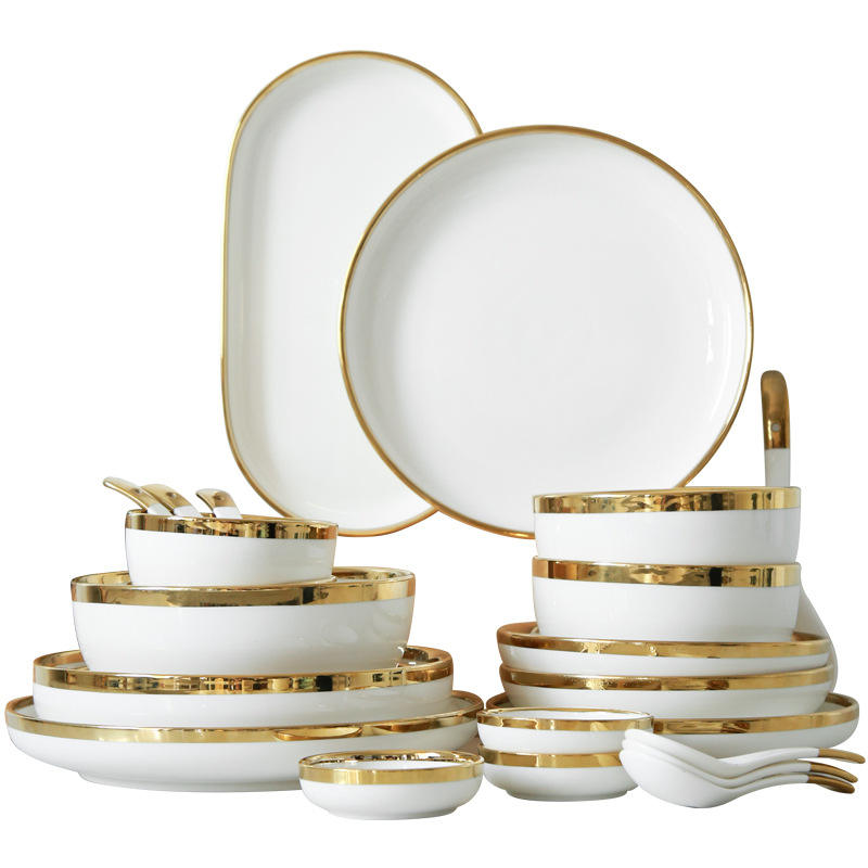 Elegant 32-piece ceramic dinner set in midnight blue on a dining table.