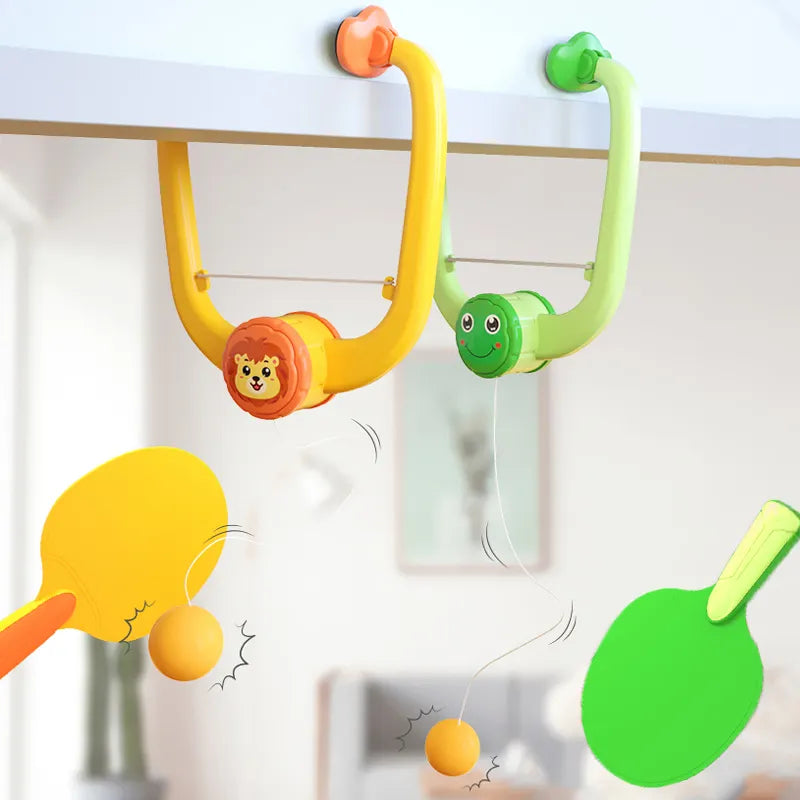 Wall-mounted table tennis trainer with orange and green paddles.