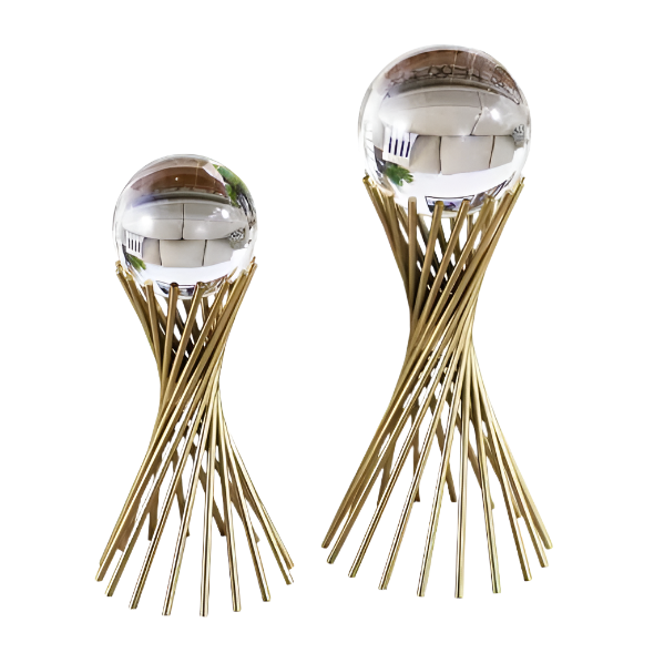 Two gold twisted rod sculptures topped with clear spheres, serving as modern decorative accents for home or office.







