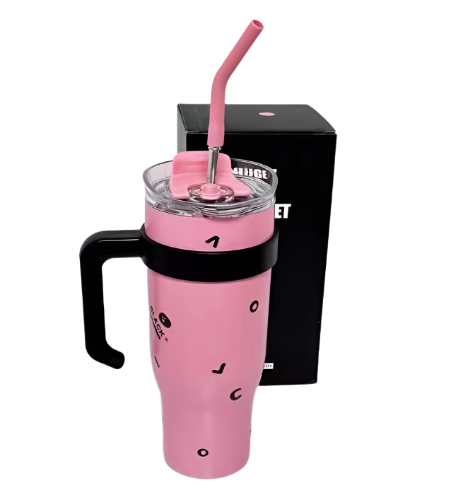 Blackpink-themed tumbler with vibrant graphics on a concert merch table.