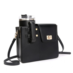 Hands-free crossbody bag worn at a gym with Stanley cup inside.