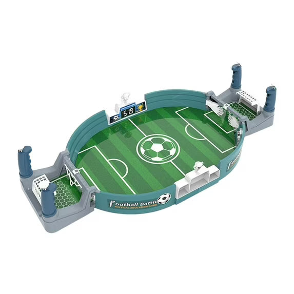 Toy football field with goalposts and soccer ball on a white background