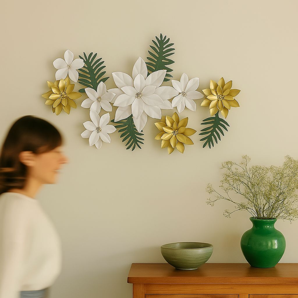 A freeform metal wall art display of multiple gold and white flowers with green leaves arranged in a vibrant cluster.







