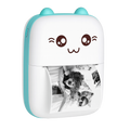 Small device with a cartoon face and photo prints on a white background