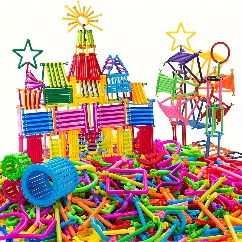 Colorful plastic building blocks and connectors on a white background