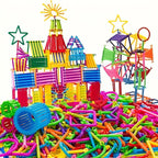 Colorful plastic building blocks and connectors on a white background