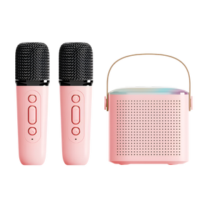 Pink microphone set with a portable speaker on a white background
