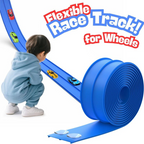 Child playing with a blue flexible race track for toy cars on a white background