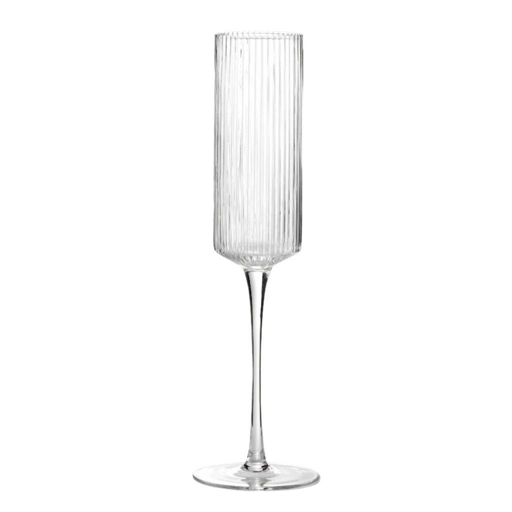 Close-up of crystal-clear flute showcasing effervescent champagne.
